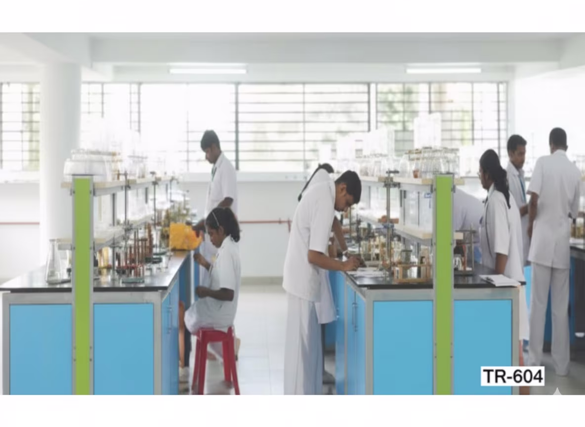 students in lab white uniform doing lab expriments 